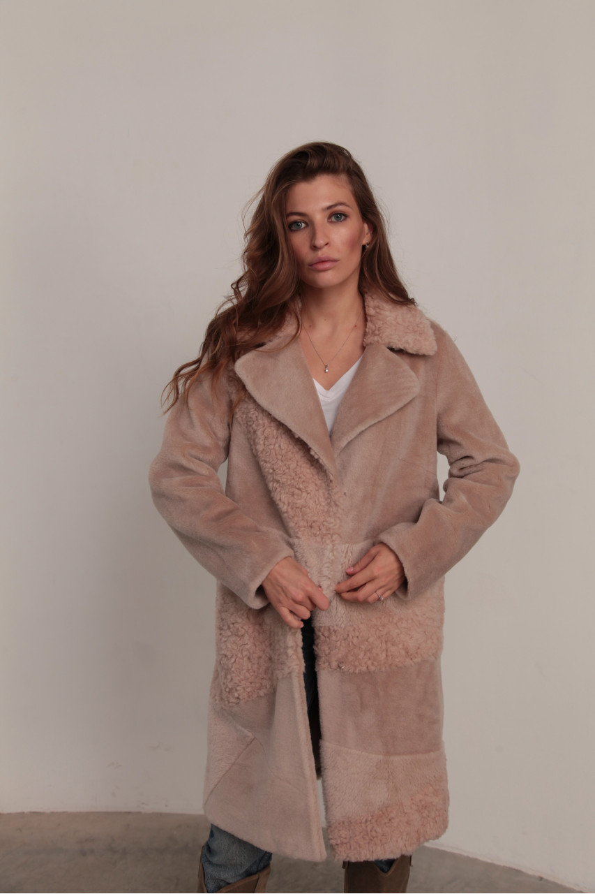 Women's sheepskin coat made of natural wool in a light caramel color