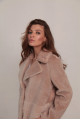 Women's sheepskin coat made of natural wool in a light caramel color