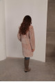 Women's sheepskin coat made of natural wool in a light caramel color