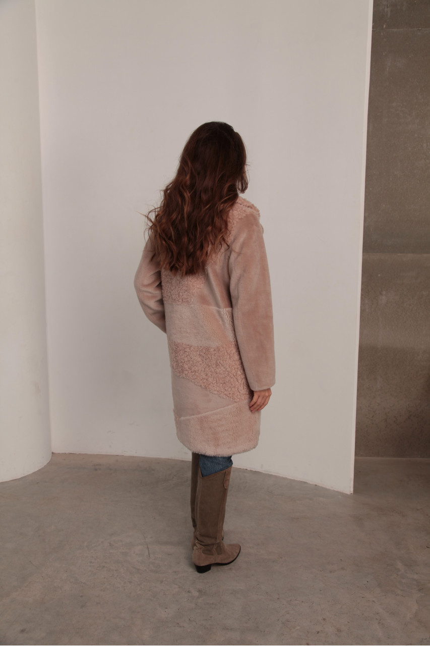 Women's sheepskin coat made of natural wool in a light caramel color